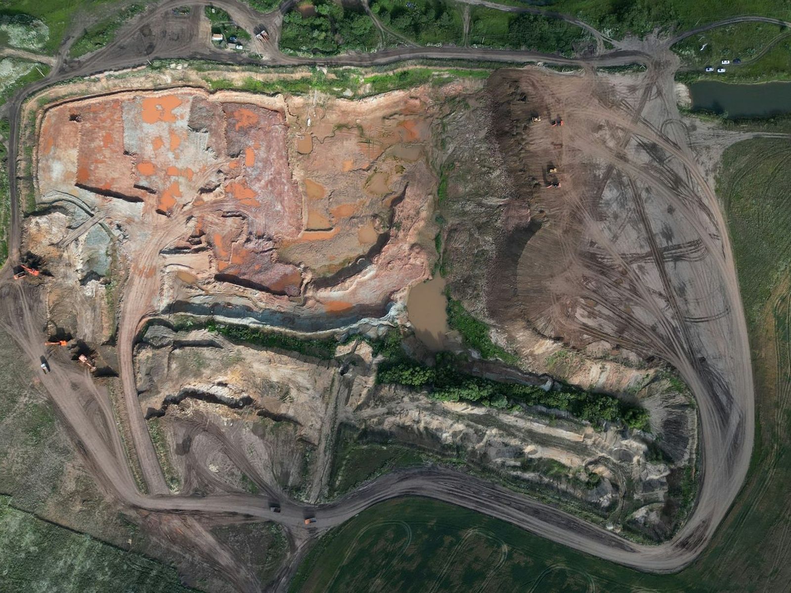 Working or restored clay or aggregate quarry from above