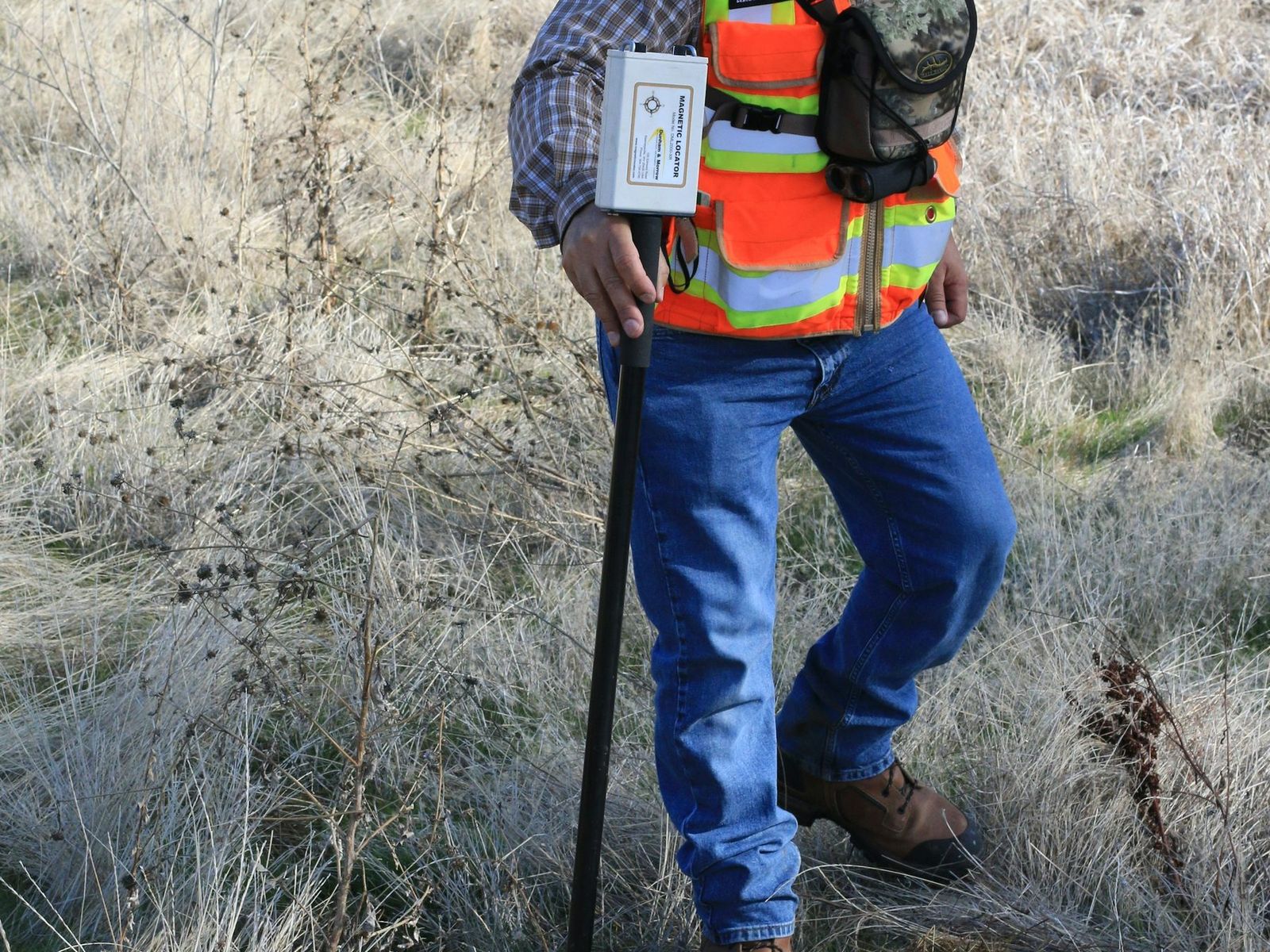 Engineer taking a gas monitoring reading at a borehole on site